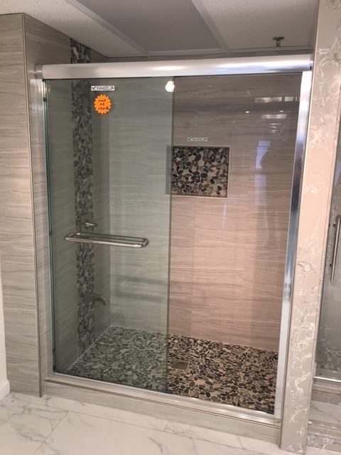 New 2019 solid quartz, no grout, shower panels. This one with a solid surface shower pan.